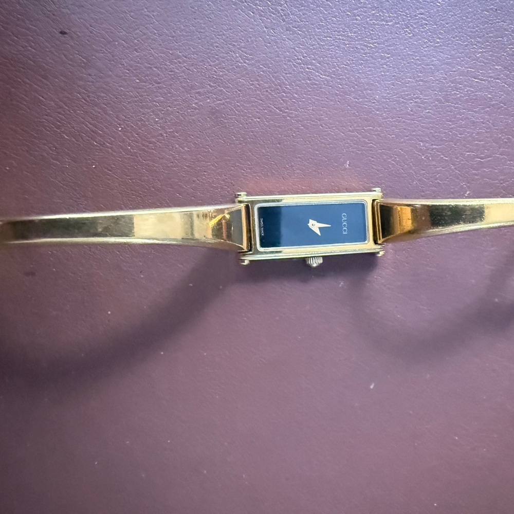 Gucci Gold Bangle Watch with Black Face